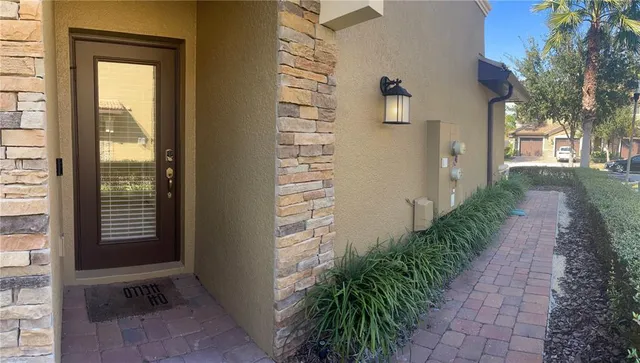 a path view of a house with a yard