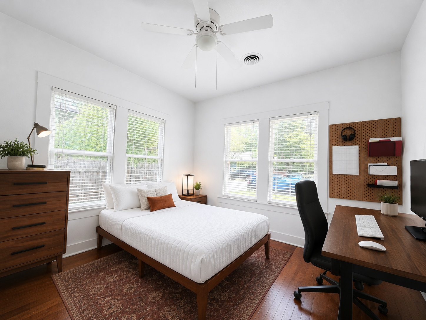 404 West 43rd Street, Unit A Austin, TX 78751 - Photo 4 of 10 a bedroom with a bed a chair and a large window