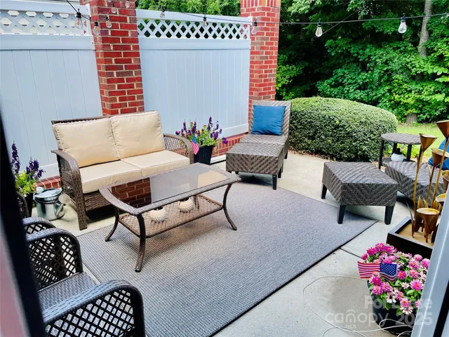 a outdoor living space with furniture and a potted plant