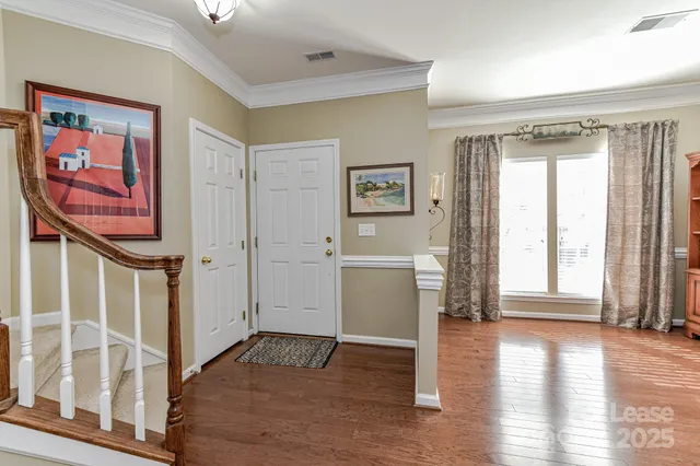 a view of entryway with wooden floor