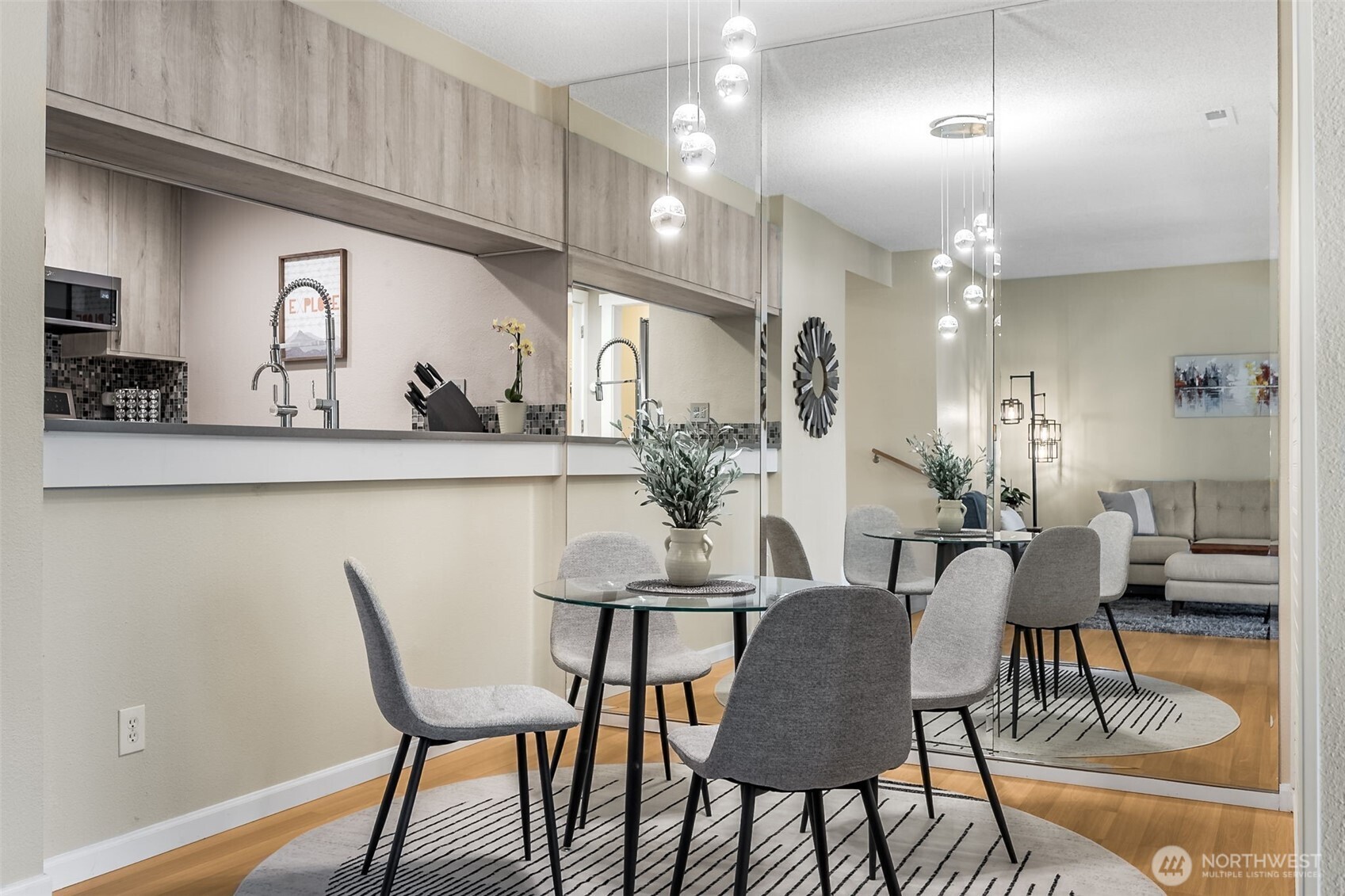7331 Old Redmond Road, Unit 121 Redmond, WA 98052 - Photo 14 of 28 a view of a dining room with furniture and wooden floor