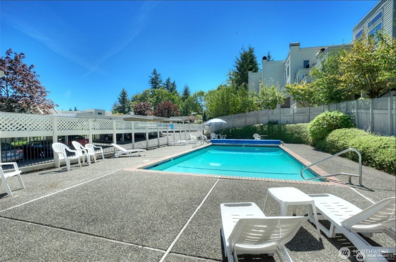 7331 Old Redmond Road, Unit 121 Redmond, WA 98052 - Photo 24 of 28 a view of a patio with table and chairs potted plants with wooden floor