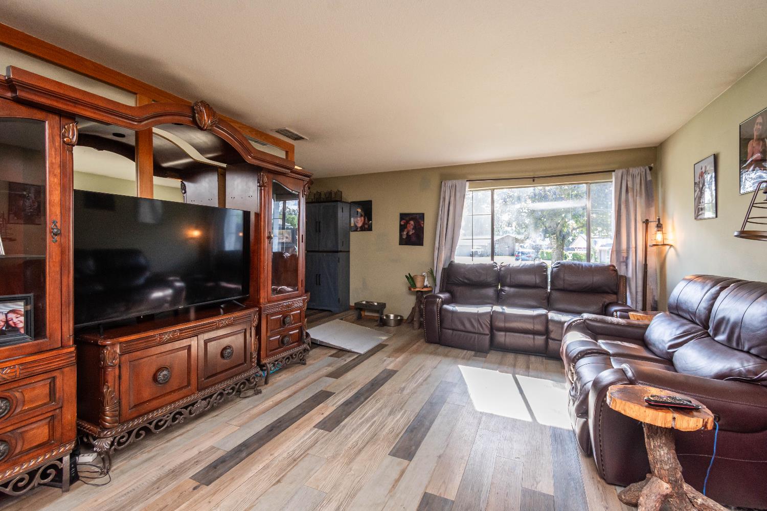 2266 River Trails Circle Rancho Cordova, CA 95670 - Photo 14 of 86 a living room with furniture and a flat screen tv