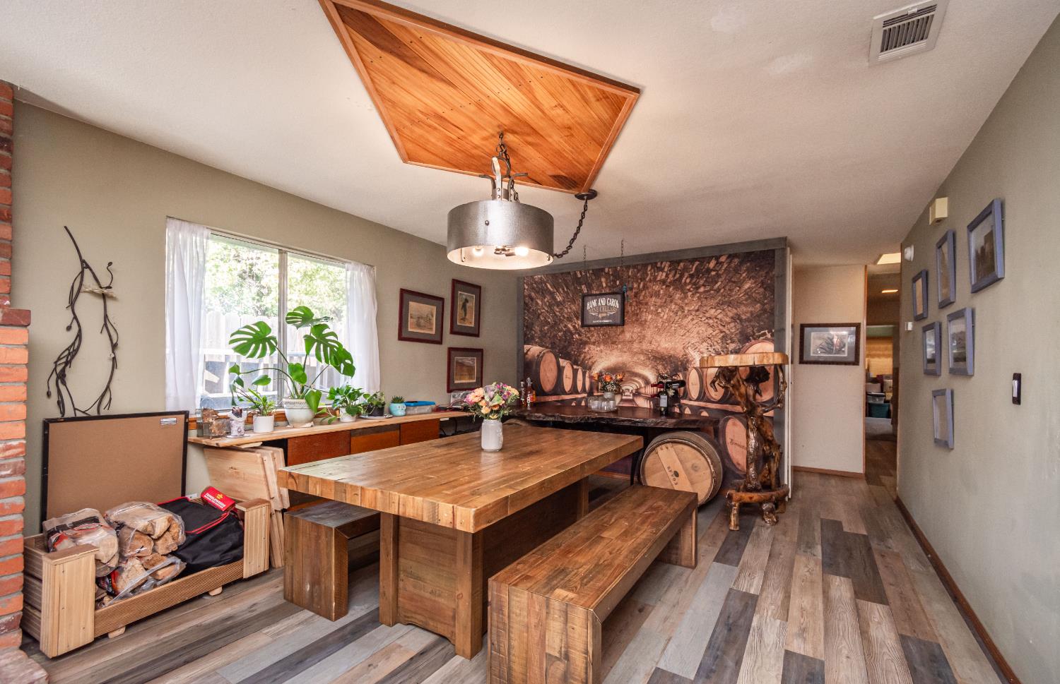 2266 River Trails Circle Rancho Cordova, CA 95670 - Photo 16 of 86 a view of a dining room with furniture a chandelier and wooden floor