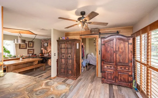 a view of a patio with table and chairs and potted plants