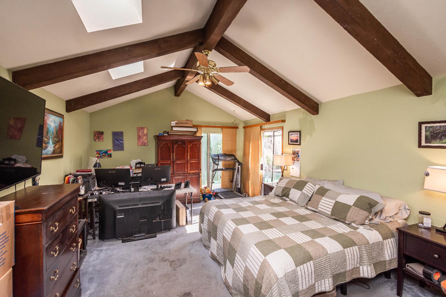 2266 River Trails Circle Rancho Cordova, CA 95670 - Photo 29 of 86 a bedroom with a bed dresser and a flat tv screen