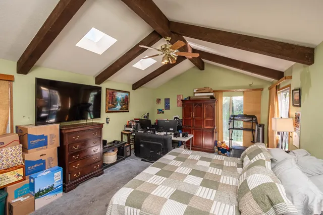 a view of patio with table and chairs and potted plants