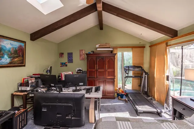 a view of a house with backyard porch and sitting area