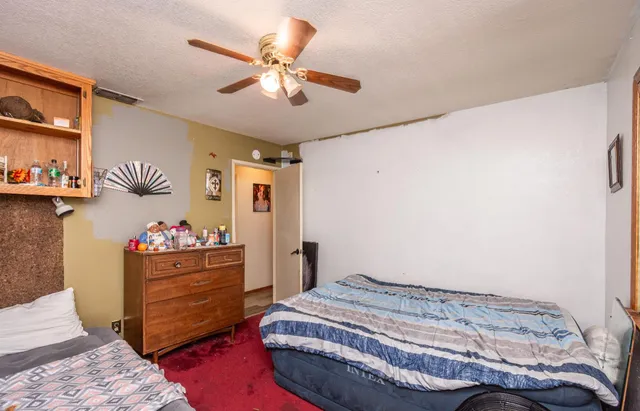 an aerial view of a house with a yard and garden