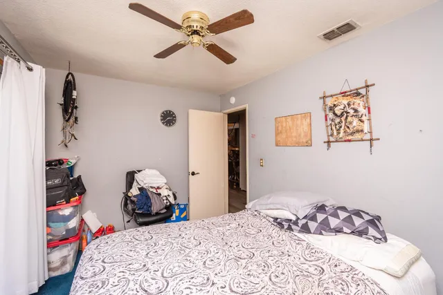 an aerial view of a house with a yard and garden