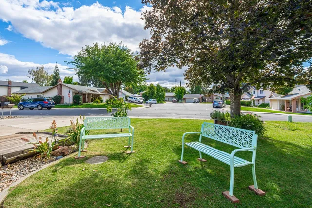 a view of living room kitchen with furniture and wooden floor