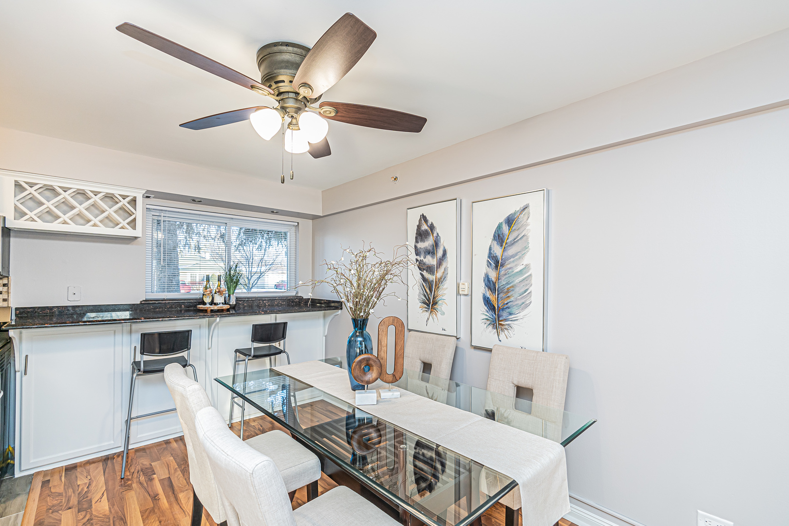1480 Busse Road, Unit 1D Mount Prospect, IL 60056 - Photo 15 of 34 a view of a dining room with furniture and chandelier