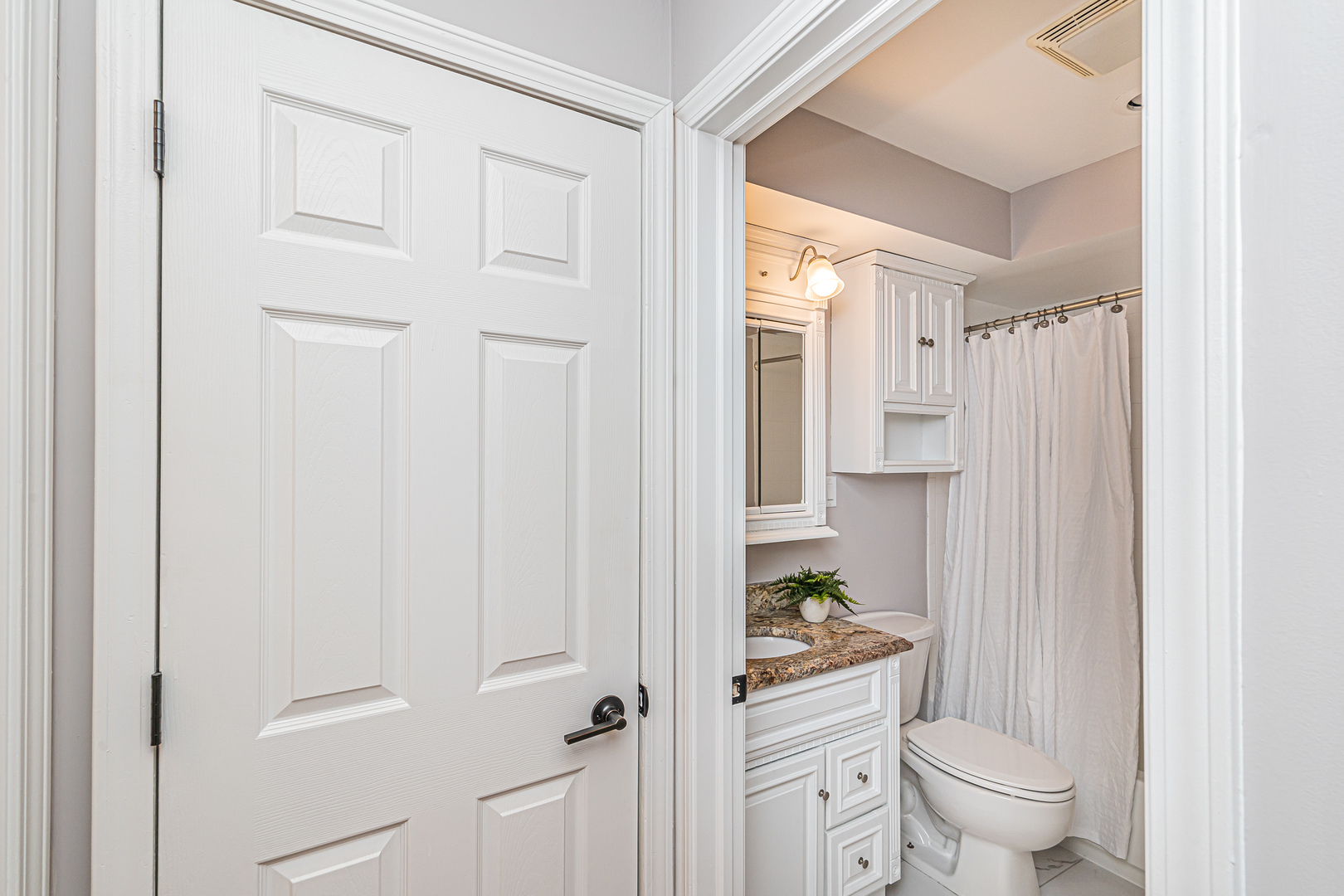 1480 Busse Road, Unit 1D Mount Prospect, IL 60056 - Photo 22 of 34 a bathroom with a shower toilet and sink