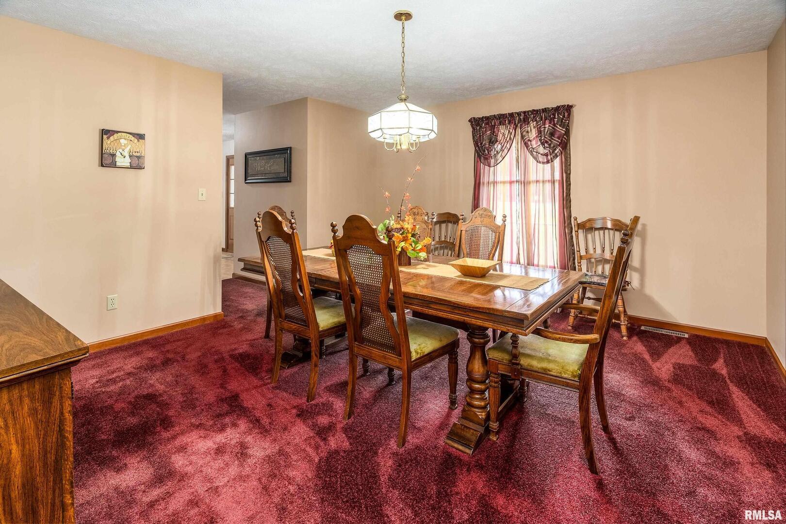 11688 Strawberry Road Carbondale, IL 62901 - Photo 15 of 36 a view of a dining room with furniture and window