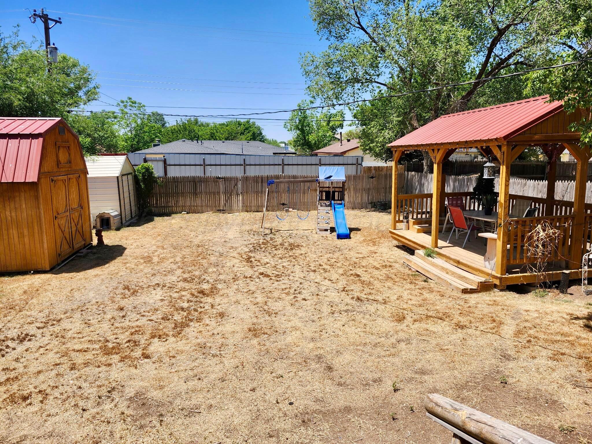 4404 South Fannin Street Amarillo, TX 79110 - Photo 12 of 13 a view of a house with a yard and sitting area