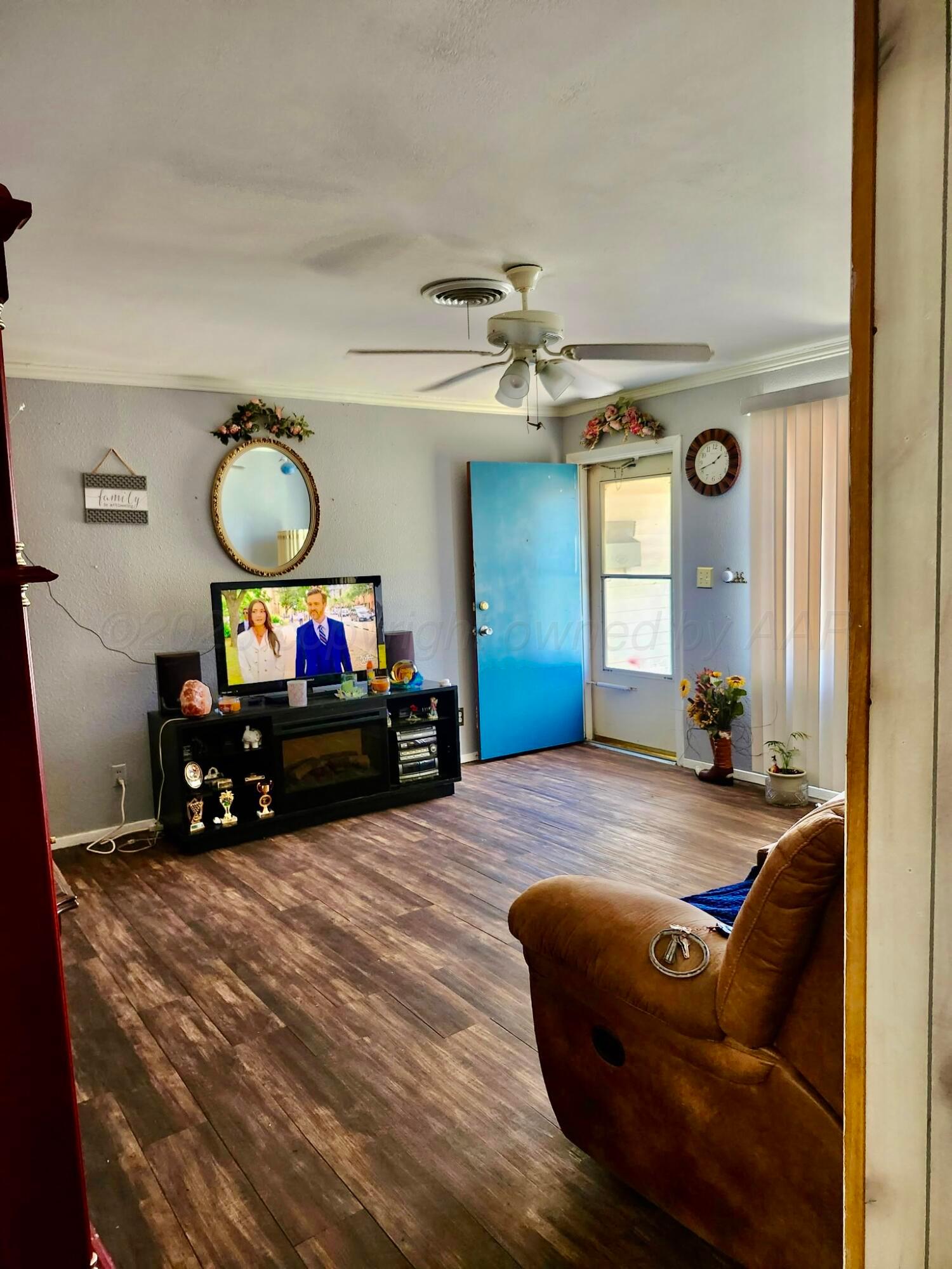 4404 South Fannin Street Amarillo, TX 79110 - Photo 3 of 13 a living room with furniture and a flat screen tv