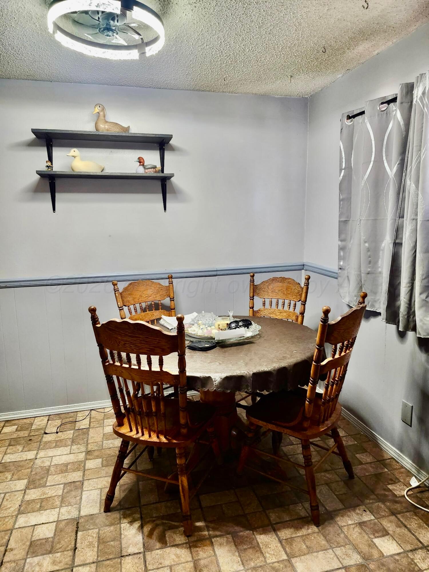 4404 South Fannin Street Amarillo, TX 79110 - Photo 6 of 13 a view of a dining room with furniture and a rug