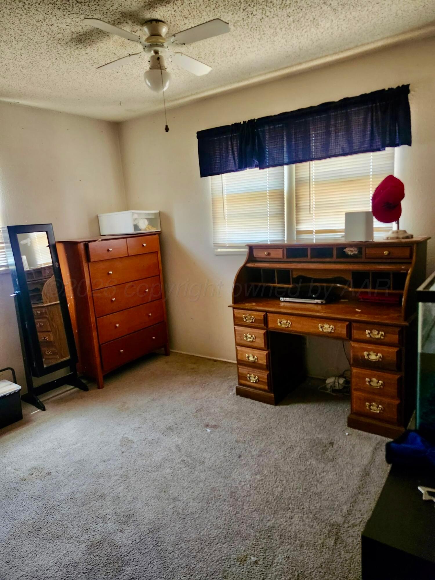 4404 South Fannin Street Amarillo, TX 79110 - Photo 9 of 13 a room with furniture and closet