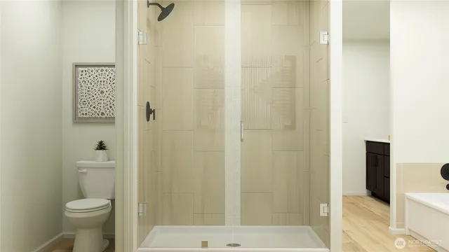 a bathroom with a shower and a toilet