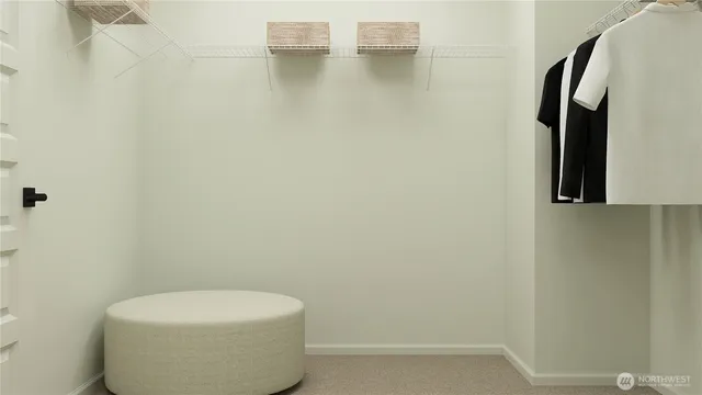 a white toilet sitting next to a white sink