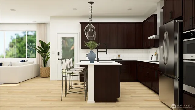 a kitchen with a refrigerator and a sink