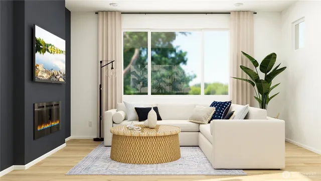 a living room with furniture and a potted plant