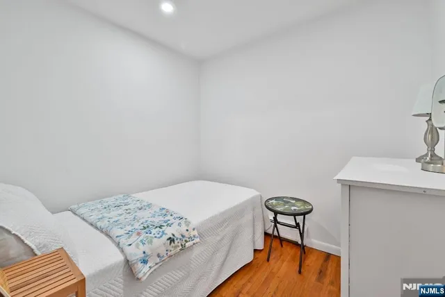 a bedroom with a bed and a table in it