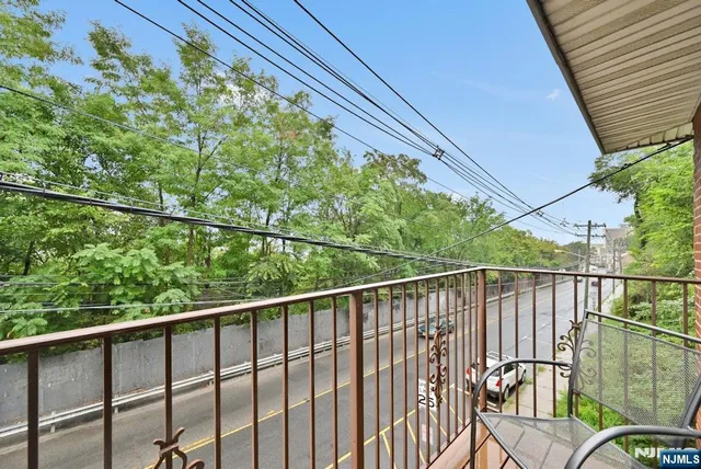 a balcony with wooden floor