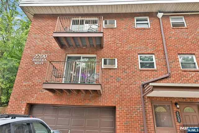 a front view of residential houses with street
