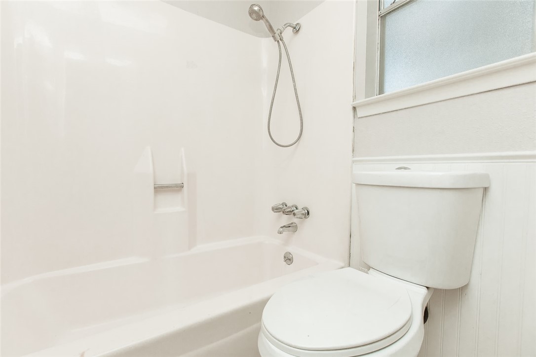 1012 Milford Way Austin, TX 78745 - Photo 11 of 21 a bathroom with a toilet and a shower