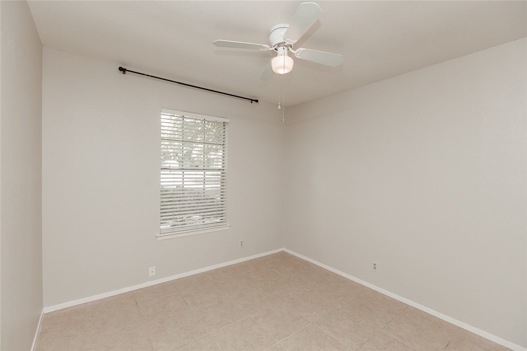 1012 Milford Way Austin, TX 78745 - Photo 16 of 21 an empty room with a window and a fan