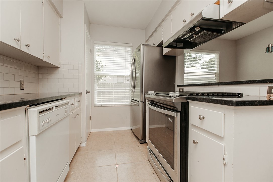 1012 Milford Way Austin, TX 78745 - Photo 5 of 21 a kitchen with cabinets appliances and a window