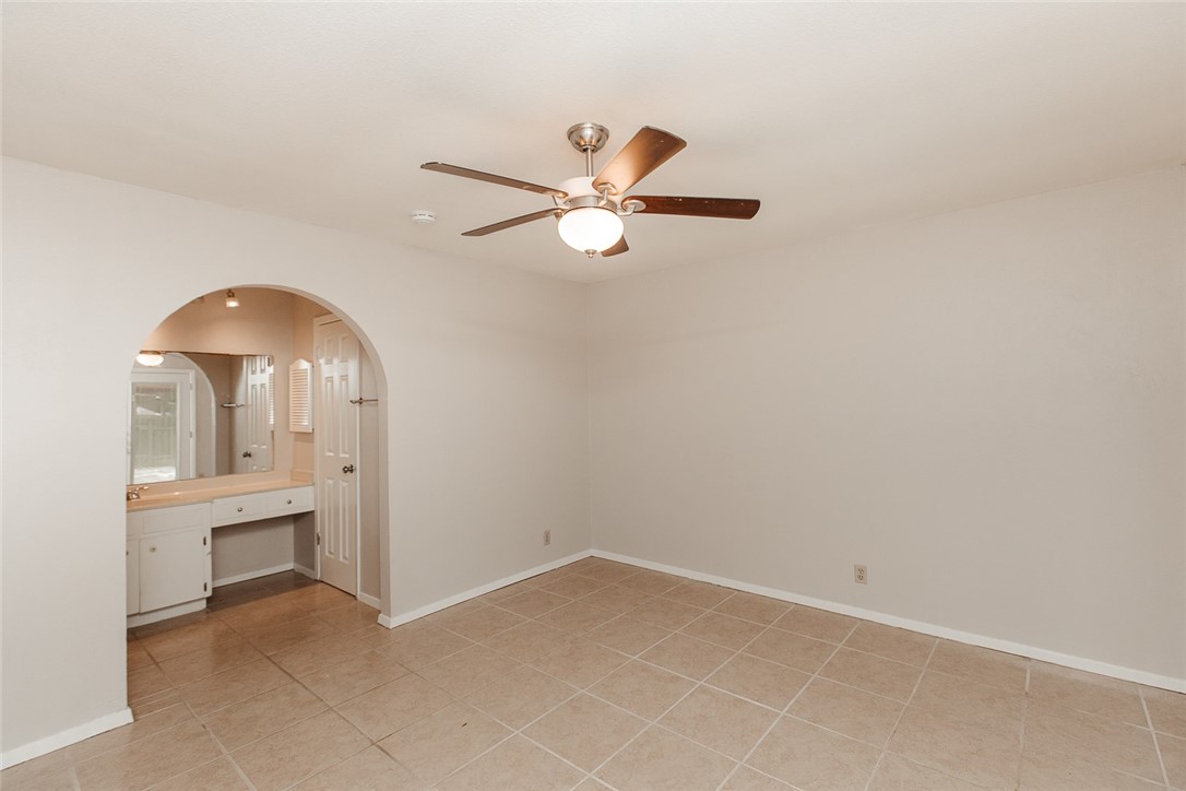 1012 Milford Way Austin, TX 78745 - Photo 7 of 21 a view of room with a ceiling fan and window
