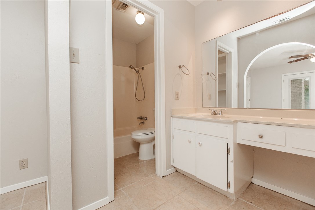 1012 Milford Way Austin, TX 78745 - Photo 9 of 21 a spacious bathroom with a granite countertop sink mirror and toilet