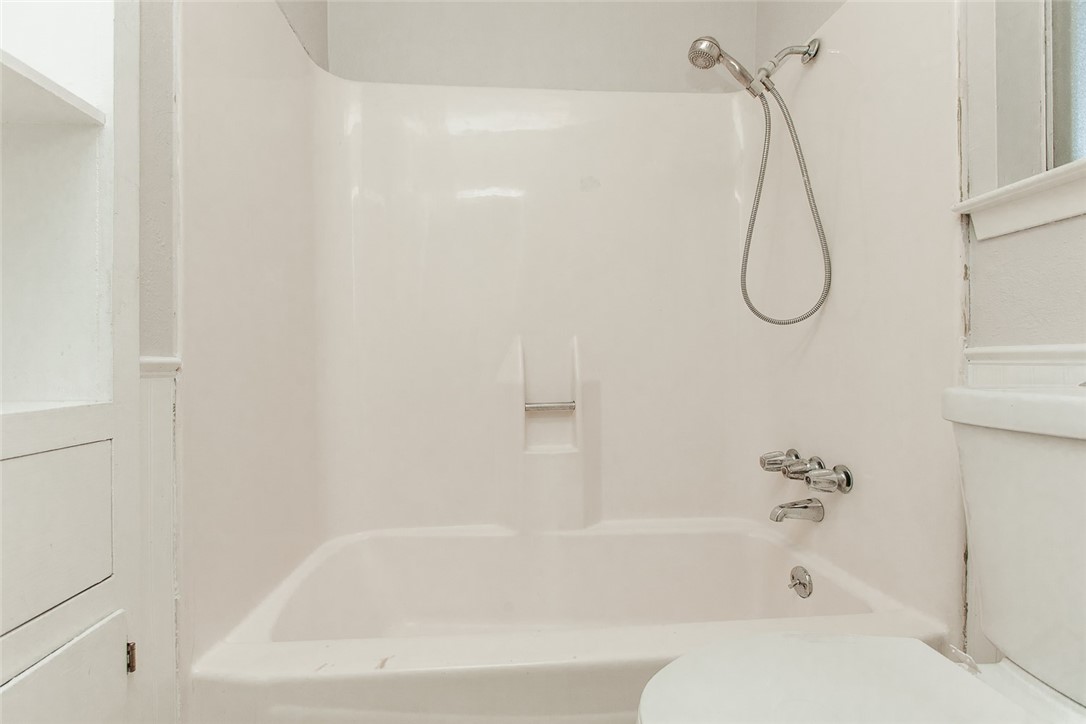 1012 Milford Way Austin, TX 78745 - Photo 10 of 21 a bathroom with a bath tub with a shower