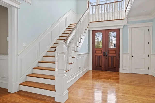 a view of wooden floor and windows in a room