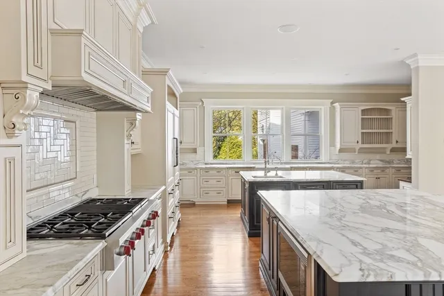 a kitchen with sink cabinets and wooden floor
