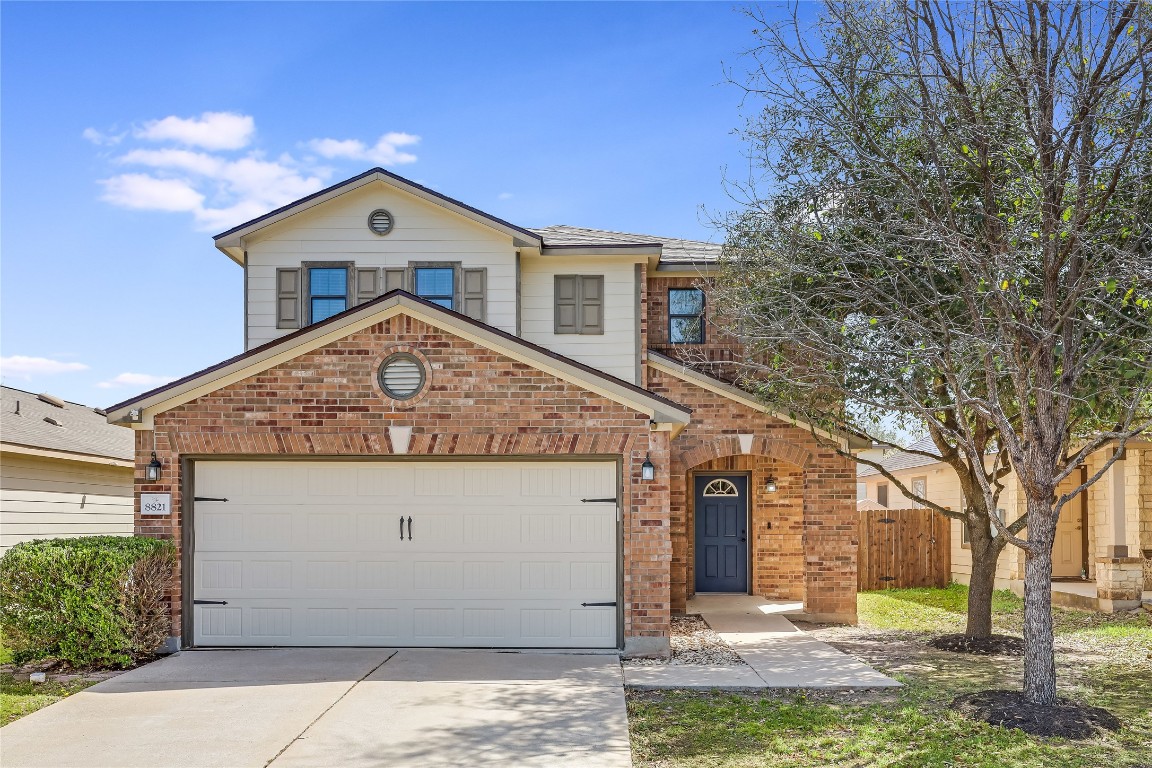 8821 Milton Lease Drive Austin, TX 78747 - Photo 1 of 1 a front view of a house with garden
