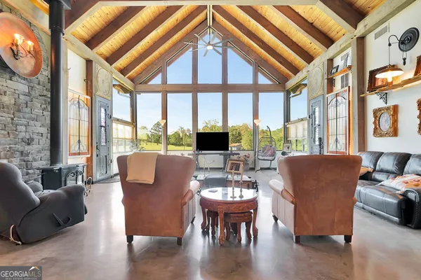 a bedroom with a bed a window and a chandelier