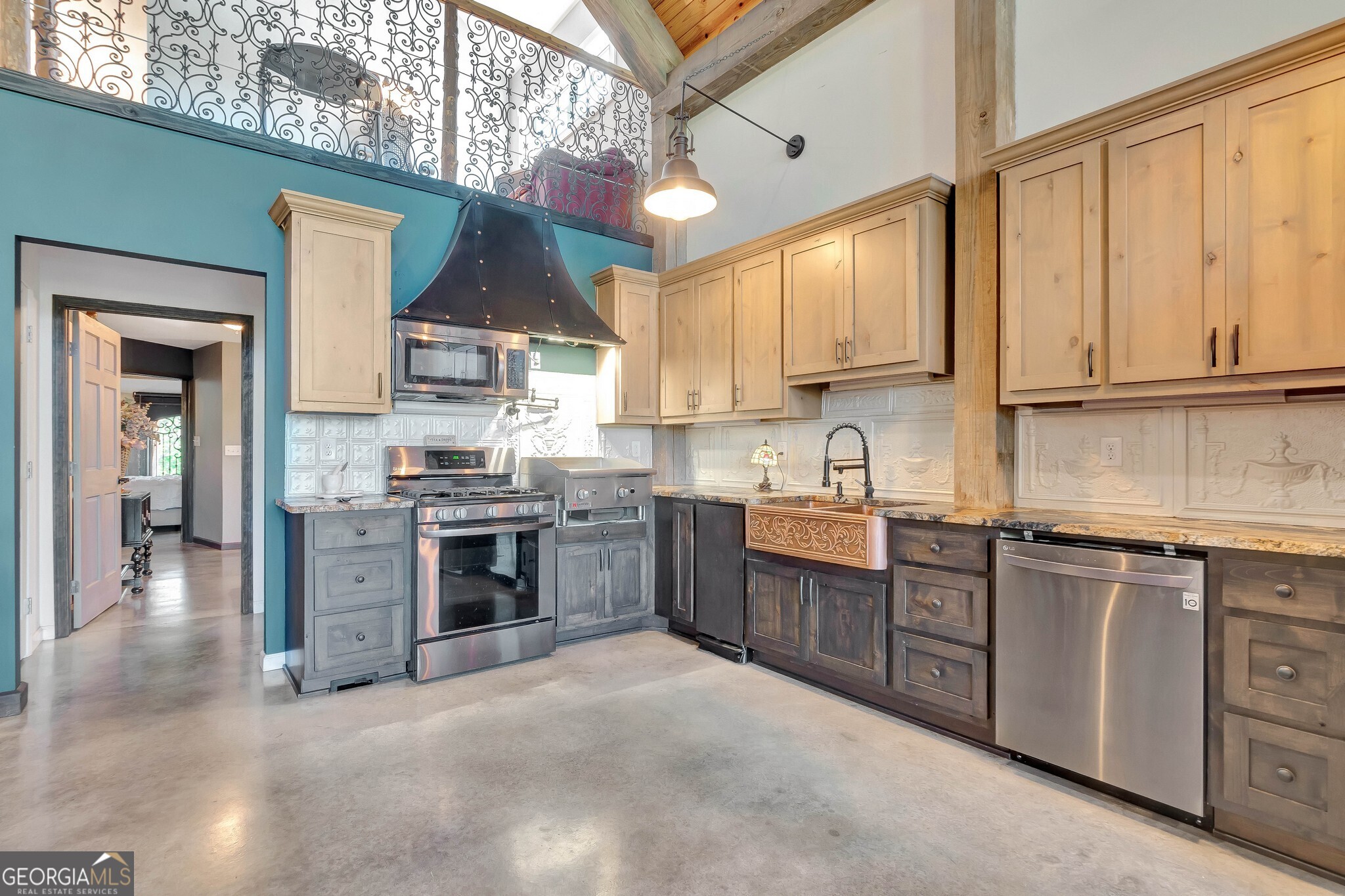 860 North Walker's Mill Road Griffin, GA 30223 - Photo 20 of 116 a kitchen with stainless steel appliances granite countertop a stove sink and cabinets