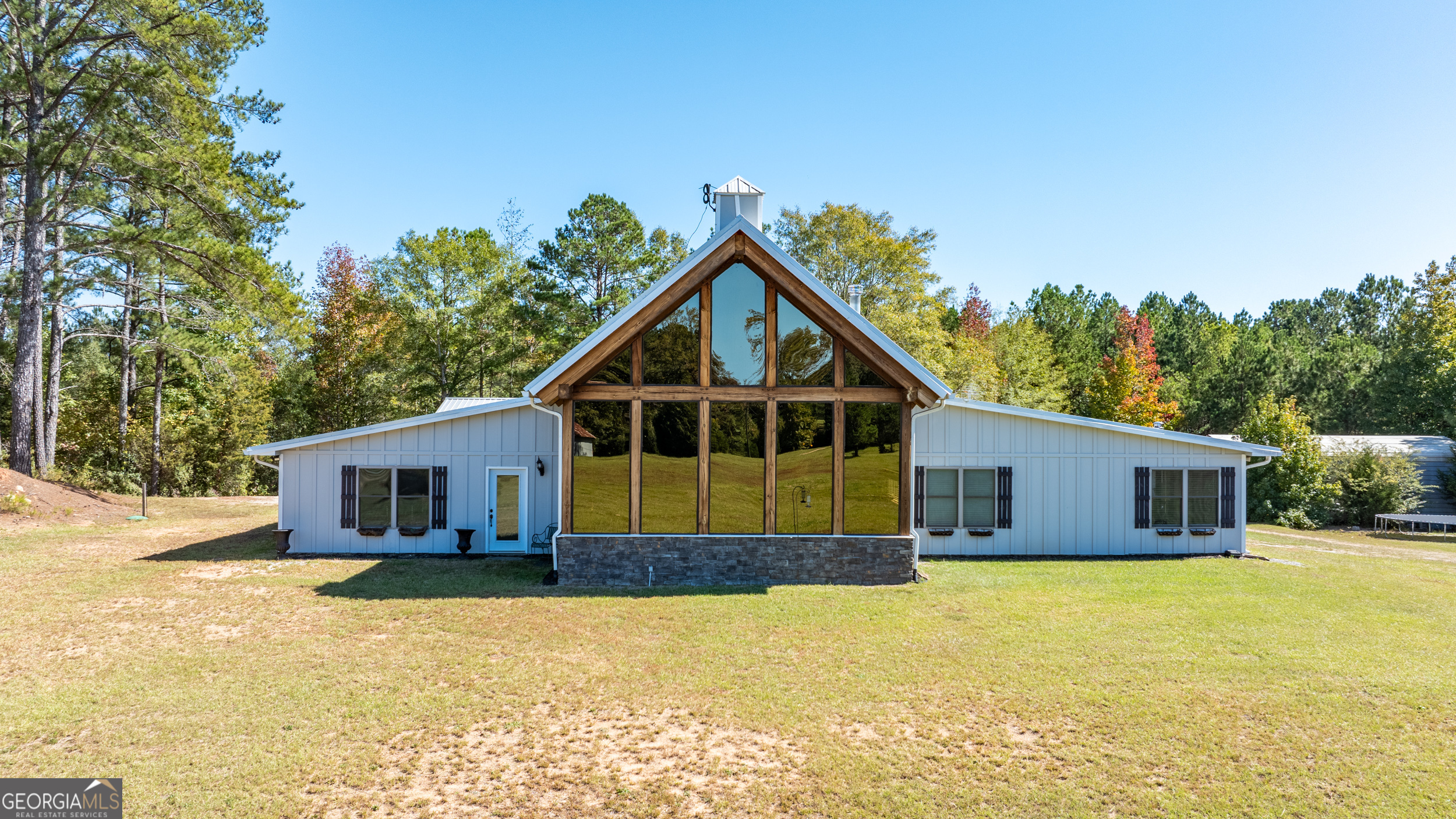860 North Walker's Mill Road Griffin, GA 30223 - Photo 2 of 116 a front view of house with yard outdoor seating and barbeque oven