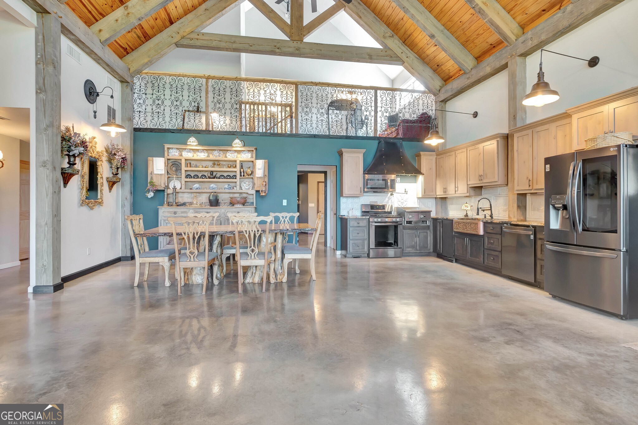 860 North Walker's Mill Road Griffin, GA 30223 - Photo 24 of 116 a kitchen with stainless steel appliances granite countertop a refrigerator and a stove top oven