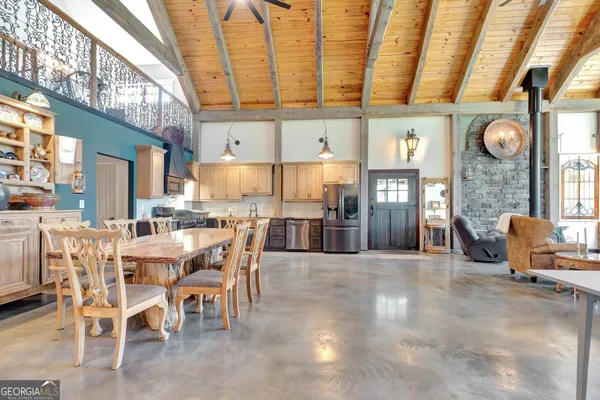 a bedroom with a bed next to a window with outer view