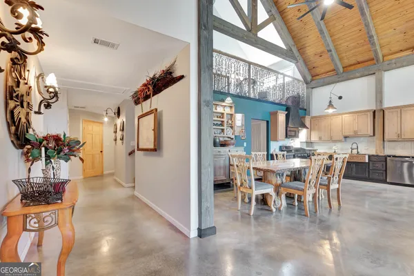 a bedroom with a bed and a table