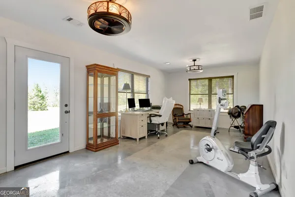 a bathroom with a sink vanity and a mirror