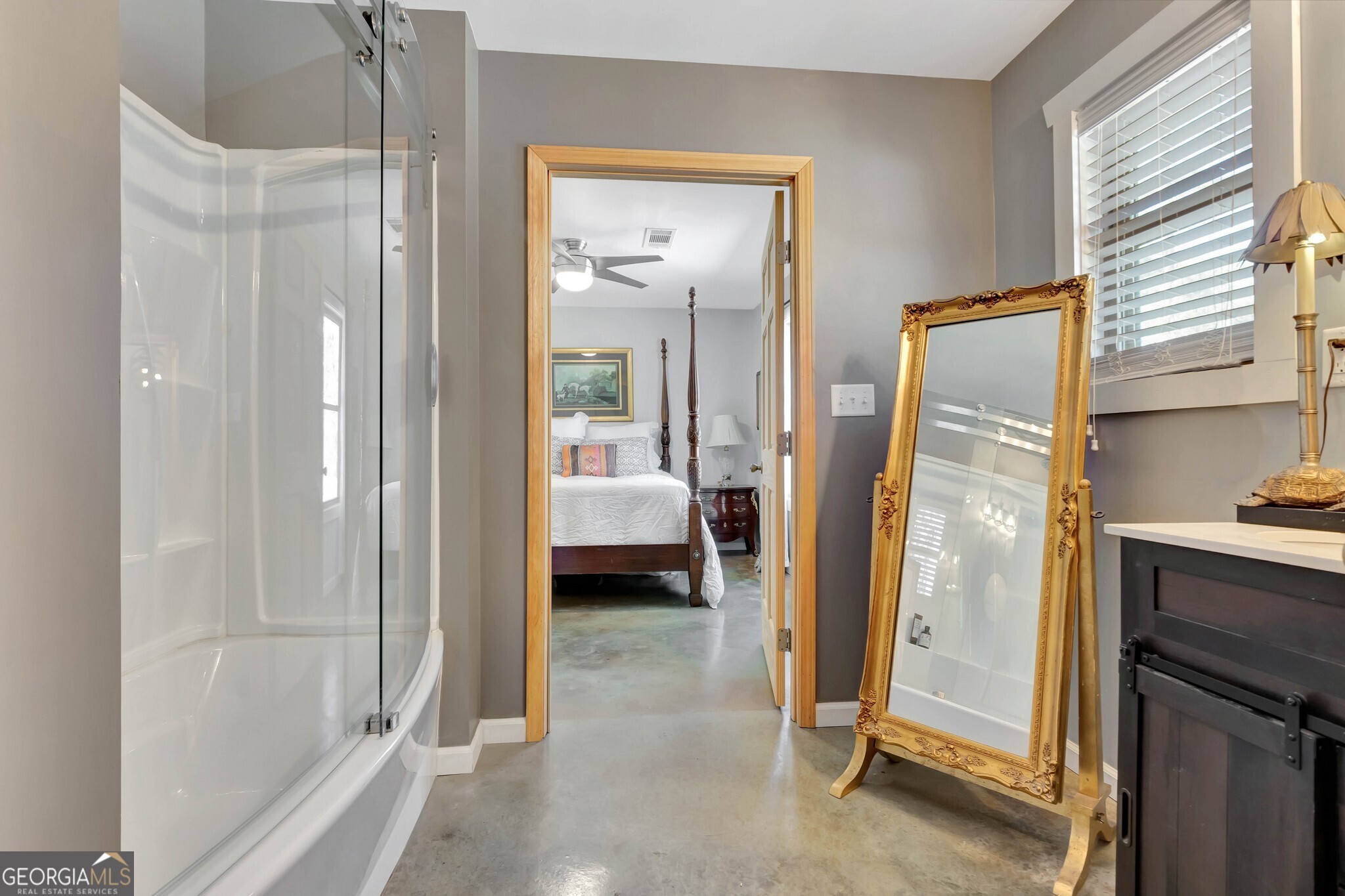 860 North Walker's Mill Road Griffin, GA 30223 - Photo 35 of 116 a en suite bathroom with a sink and a mirror