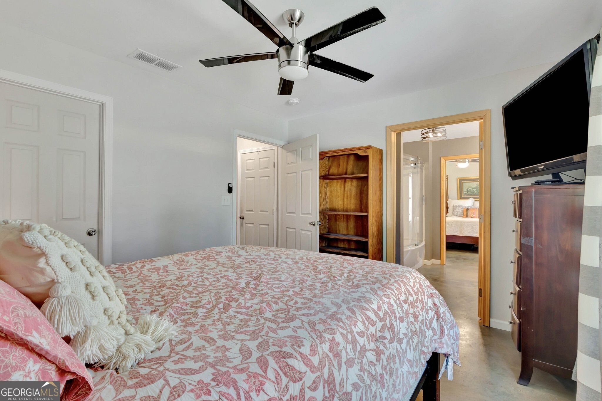 860 North Walker's Mill Road Griffin, GA 30223 - Photo 37 of 116 a bedroom with a bed and a flat screen tv