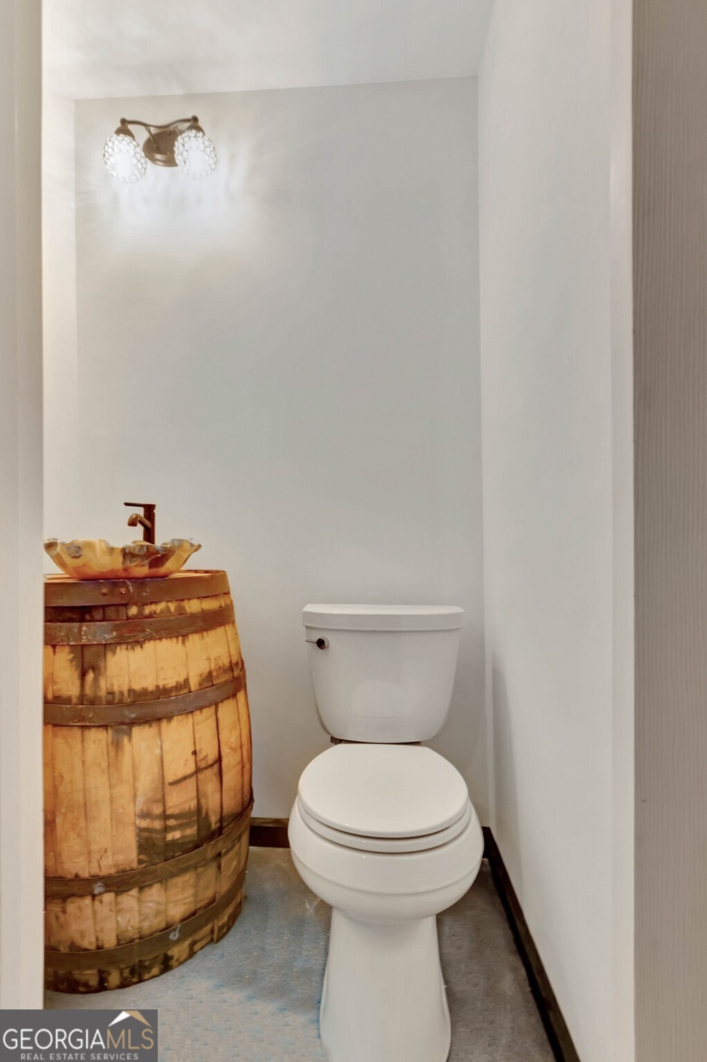 860 North Walker's Mill Road Griffin, GA 30223 - Photo 42 of 116 a bathroom with a toilet and a sink