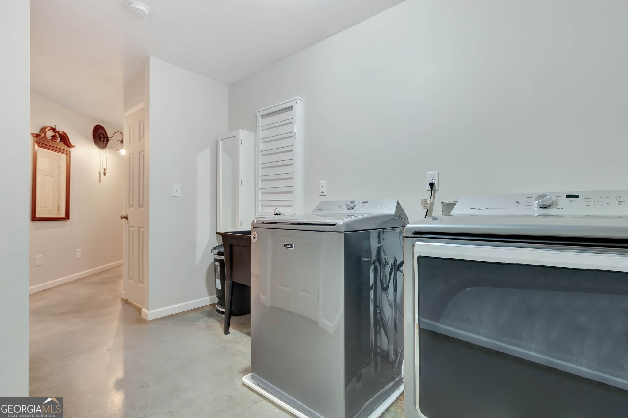 860 North Walker's Mill Road Griffin, GA 30223 - Photo 43 of 116 a utility room with cabinets and washer