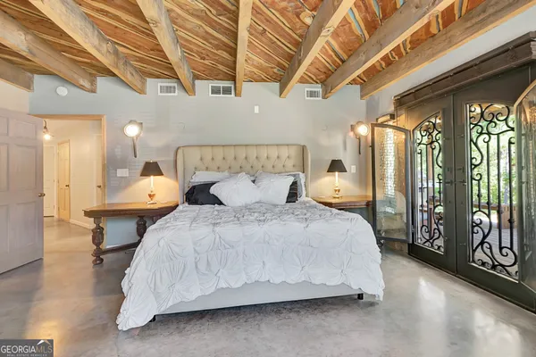 a view of a yard with plants and trees